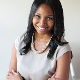 black woman with cream top and cream background